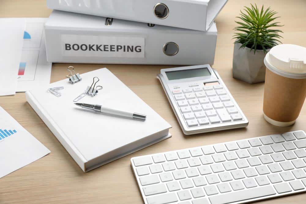 Two people reviewing financial documents
